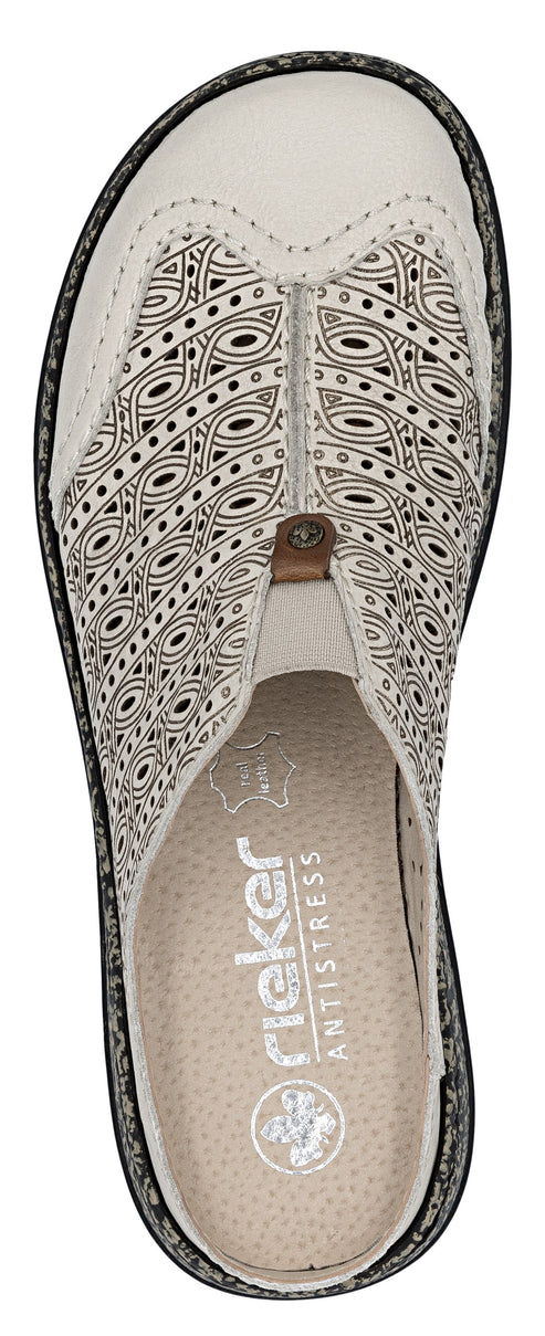 A white perforated mule shoe with a low heel and the text "rieker ANTISTRESS" on the insole.