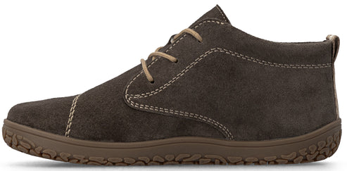 A side view of a brown suede lace-up boot with a flat, textured rubber sole and visible light-colored stitching details.