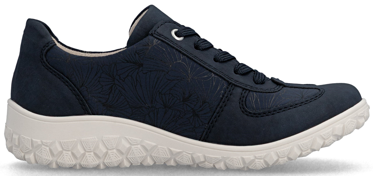 A navy shoe with floral pattern and white sole.