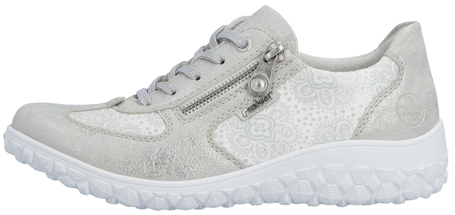 A silver Rieker women's sneaker with a white sole and a zipper.