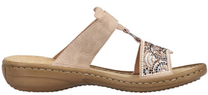 Beige sandal with decorative embellishments.