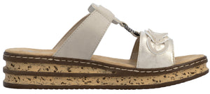 A women's white sandal with a wedge heel.