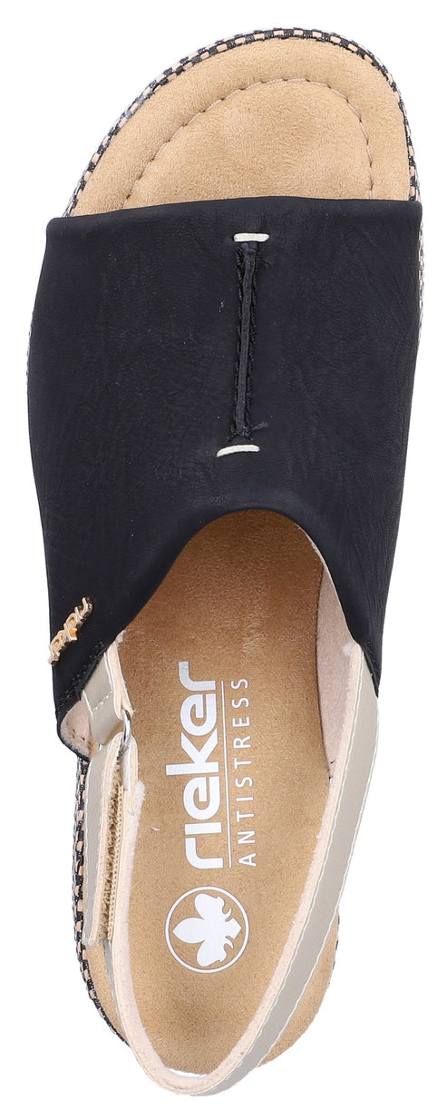 A black open toe sandal with a cream insole and a rieker antistress logo.