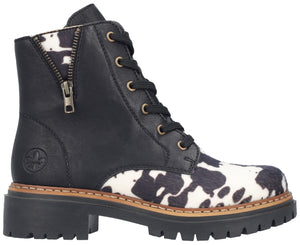 A black leather lace-up boot with a thick lugged sole, cow-print patterned panels on the toe and ankle, and a decorative gold-toned side zipper.