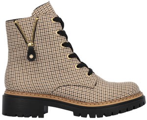 A houndstooth patterned lace-up ankle boot with black laces, gold eyelets, a thick black lug sole, and a decorative gold diagonal zipper detail on the outer side.