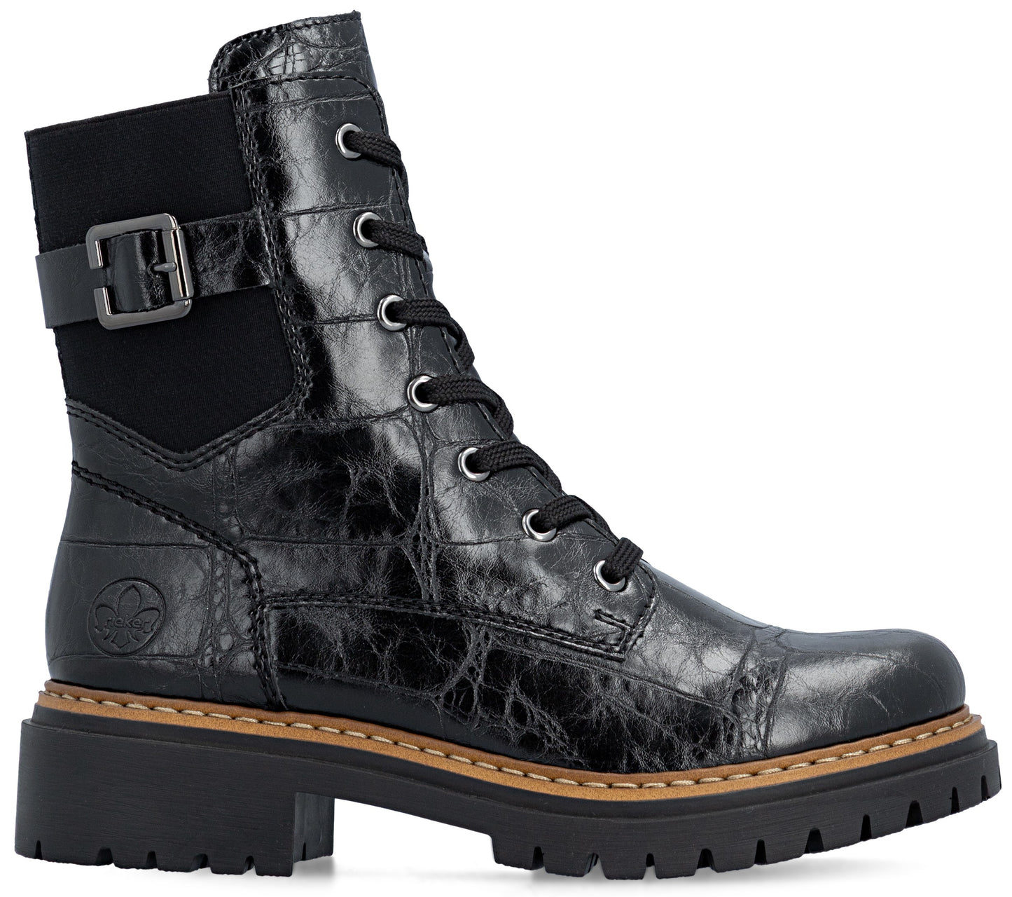 A black ankle boot with a textured, crocodile-skin pattern, featuring a side buckle strap, lace-up front with silver eyelets, and a thick, lugged rubber sole with a tan welt stitch.