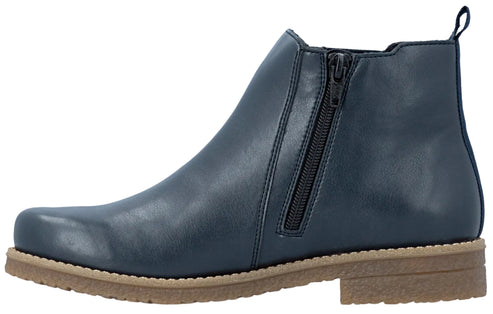 A dark navy blue synthetic leather ankle boot with a side zipper closure, pull tab at the heel, and a thick, light-brown textured rubber sole viewed from the side.