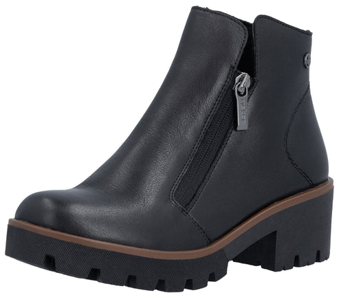 A black, ankle-high leather boot with a side zipper, a thick, lugged black platform sole, and a thin brown welt detail.
