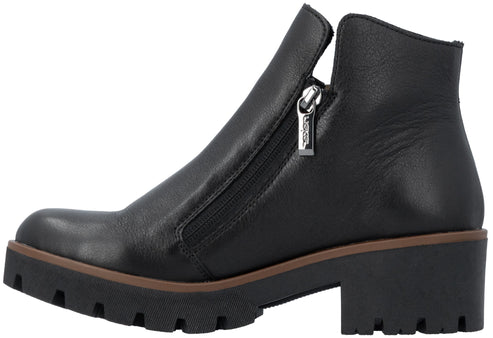 A black leather ankle boot with a chunky, lug-soled heel, a side zipper with a silver-tone metal pull, and a brown trim detail along the midsole.