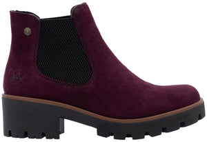 A side view of a burgundy Chelsea boot with lug sole and block heel.