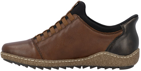 A brown leather sneaker featuring a black neoprene-like collar, a lacing system integrated into the side panels, a thick textured cork-look midsole with decorative white stitching, and a black ridged outsole.