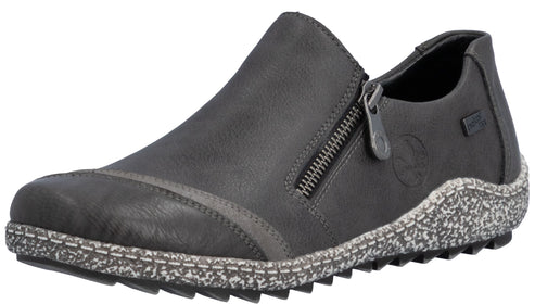 A gray slip-on shoe with a side zipper, a textured dark toe cap, and a speckled gray patterned sole.
