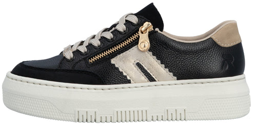 A black and beige sneaker with a gold zipper.