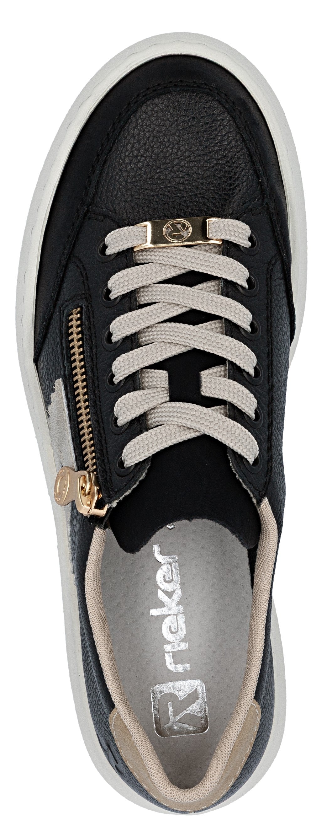 A close-up of a black sneaker with a gold zipper and white laces.