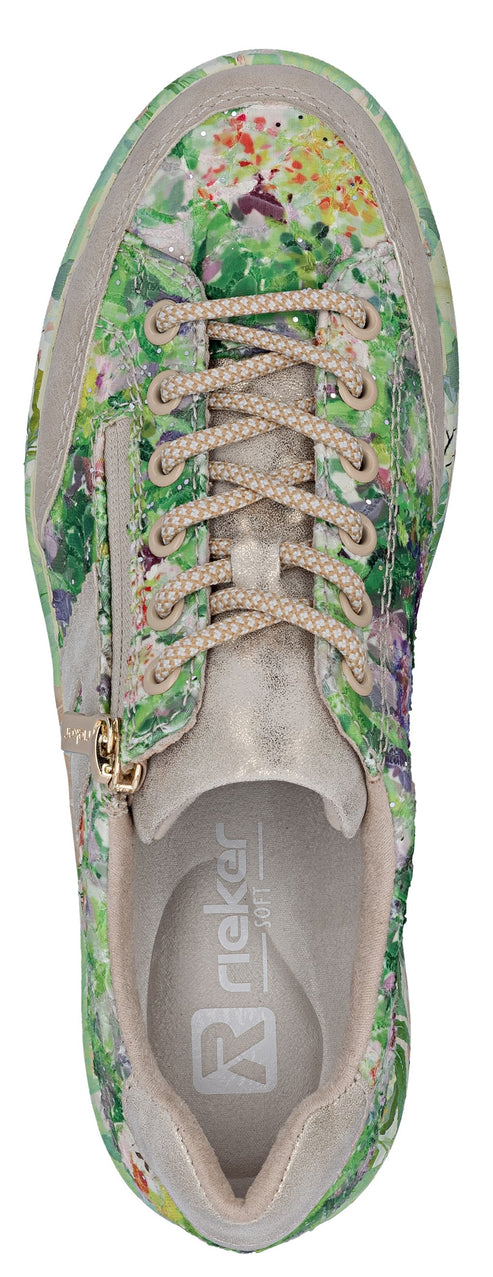 An overhead shot of a sneaker with floral print and tan laces.