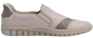 A slip-on shoe with a textured sole and a beige and gray upper.