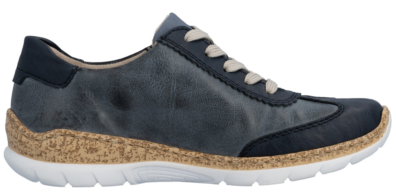 A blue leather sneaker with white laces and a cork midsole.