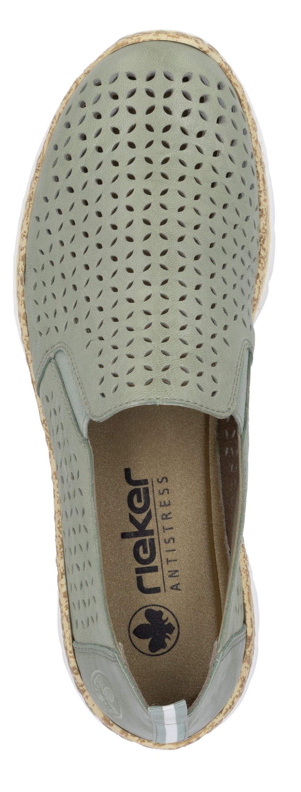 A top-down view of a light green slip-on shoe with laser-cut perforations and a tan sole.