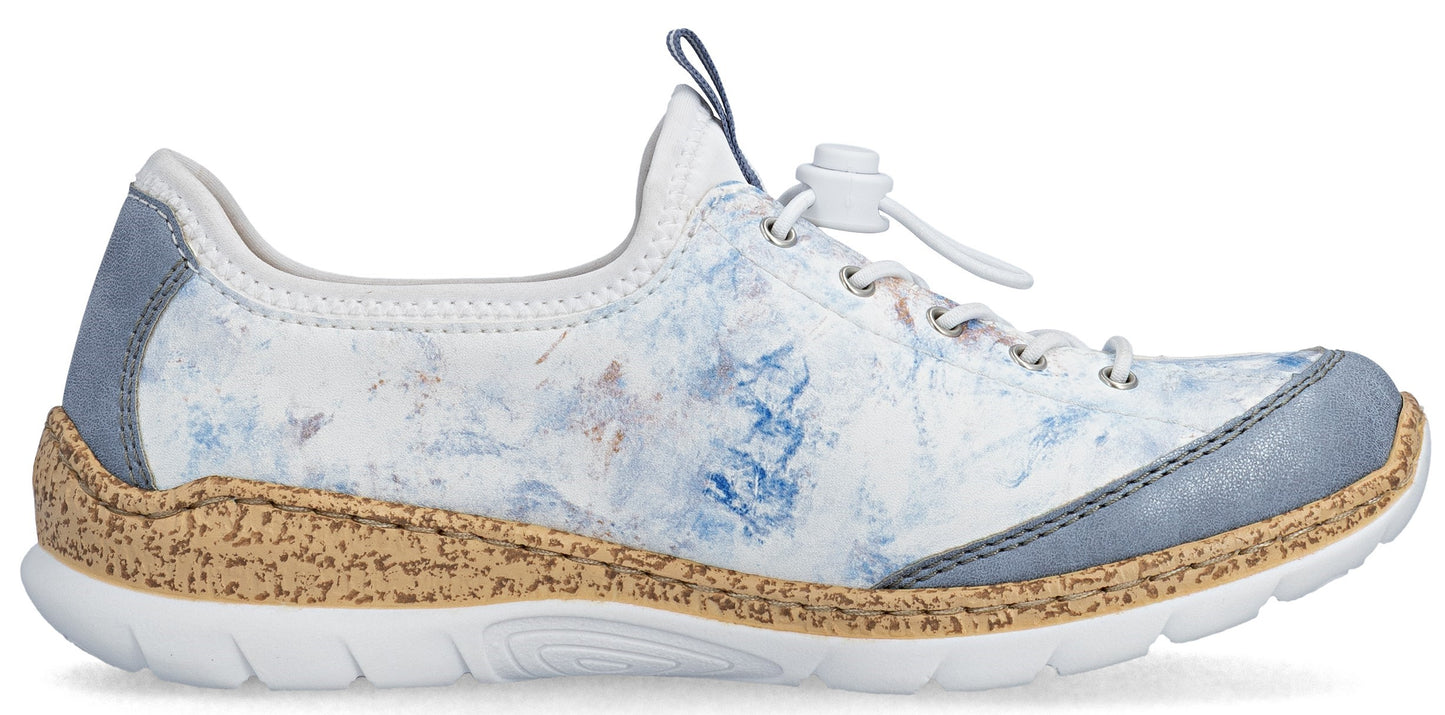 A white and blue floral shoe with gray trim and a cork midsole.