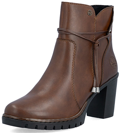 A brown leather ankle boot with a block heel, a thick lug sole, and a decorative leather wrap tie with metal accents around the ankle.