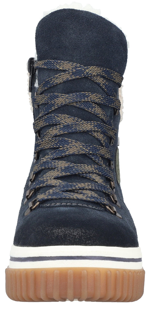 A navy blue suede ankle boot with a high lace-up closure featuring speckled olive green and navy laces, brass-tone eyelets, a white midsole, and a thick, textured tan gum rubber outsole.