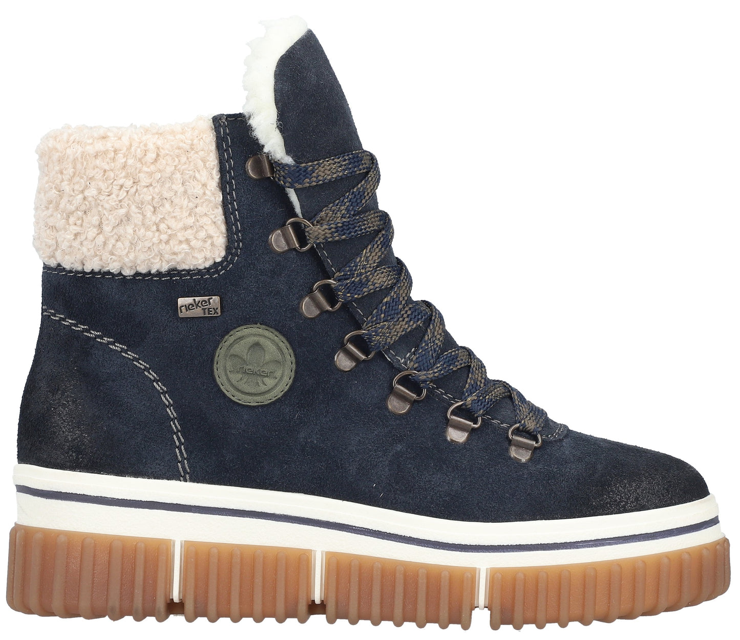A navy blue suede ankle boot with a white faux fur collar, patterned laces with metal D-ring eyelets, a white and navy striped midsole, and a thick, ridged light brown rubber outsole, featuring a small 'Rieker Tex' tag and a circular logo patch on the side.