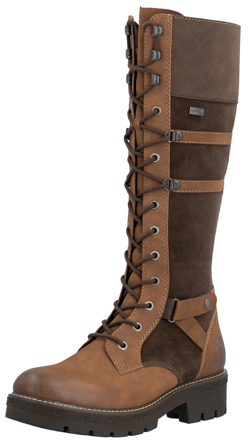 A tall, two-toned brown leather and suede lace-up boot featuring a round toe, a thick lugged rubber sole, multiple horizontal buckle straps across the calf, and metal eyelets.