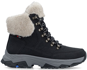 A black ankle-high winter boot with a grey lug sole and blue detail on the heel, featuring a fluffy light beige faux-fur collar, a lace-up front with dark metal eyelets, and an R-TEX label on the side.