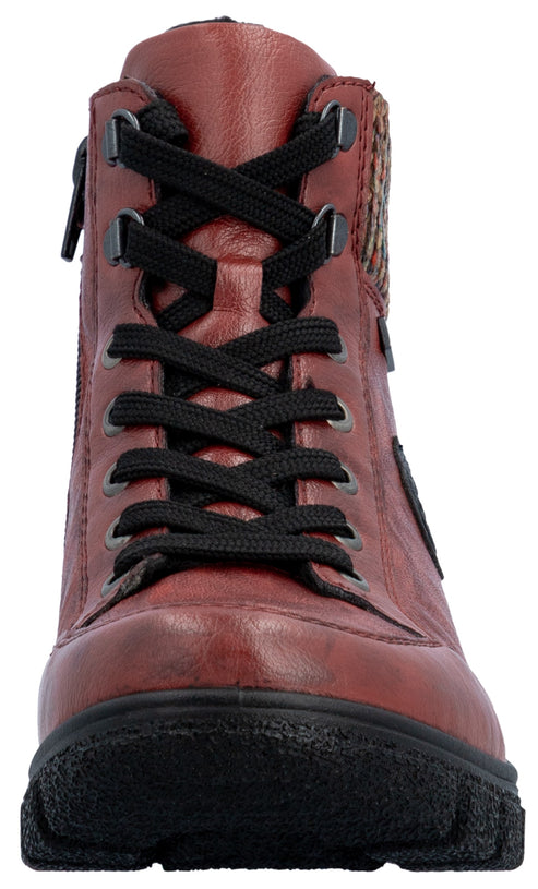 A maroon-colored, lace-up, ankle-height boot featuring black laces, a side zipper, and a textured black rubber lug sole.