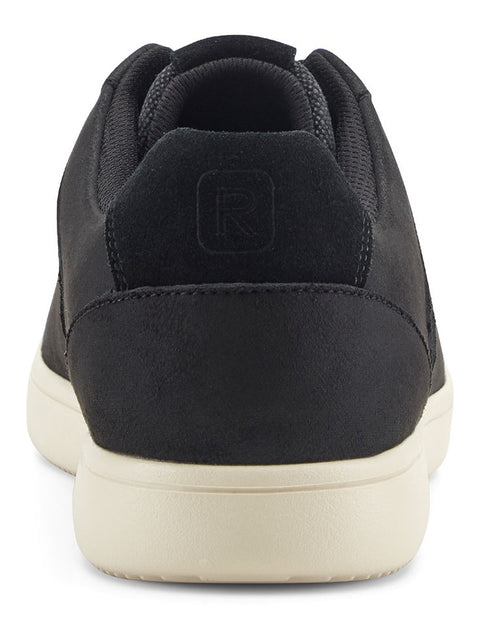 Back view of a black sneaker with a cream-colored sole and a suede heel.