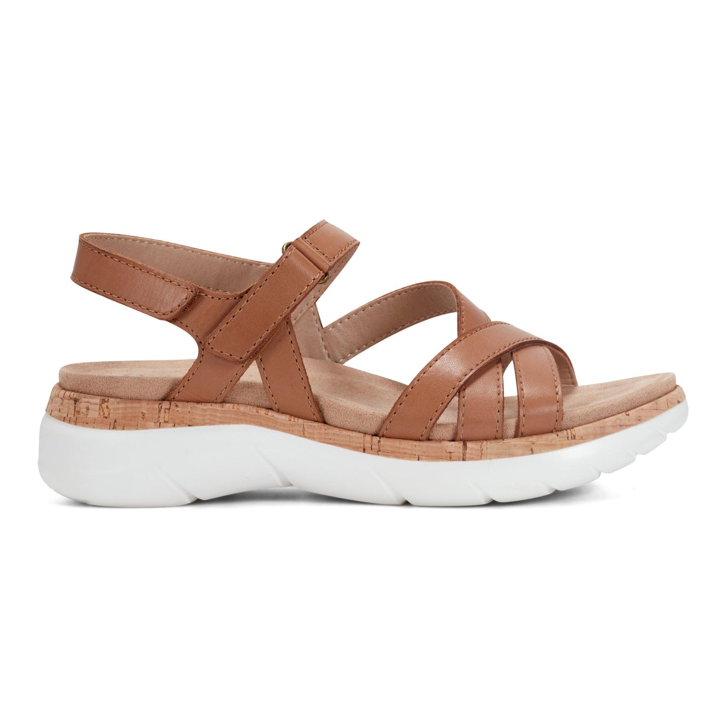 Tan sandal with adjustable velcro strap and white platform sole.