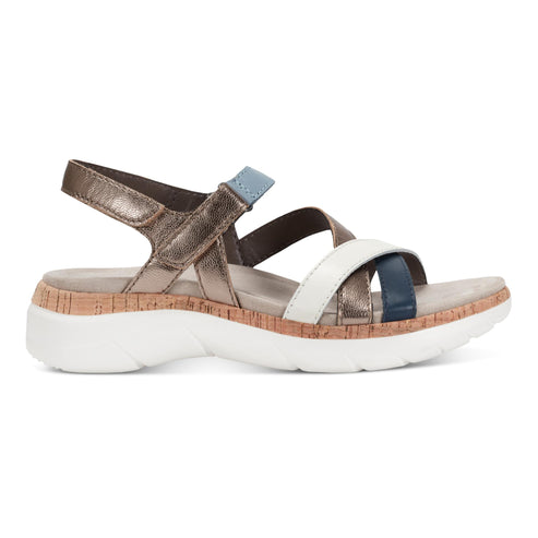 Multi-strap sandal with white sole, and cork midsole.