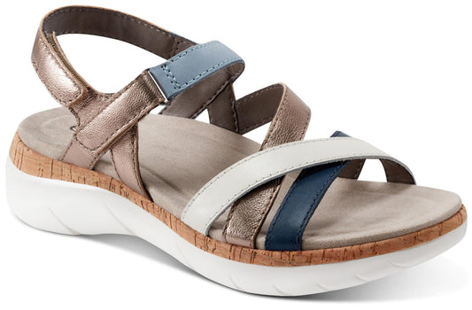 Angled view of a women's sandal with white soles, a cork footbed and metallic gold, navy and white straps.