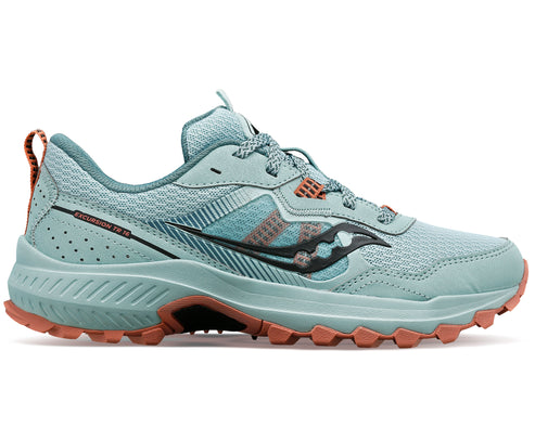 A light blue sneaker with a thick textured sole and black logo.