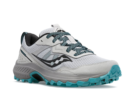Gray and teal athletic shoe with patterned laces.