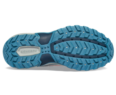 Bottom of a shoe with light blue lugged outsole and the word "Saucony".