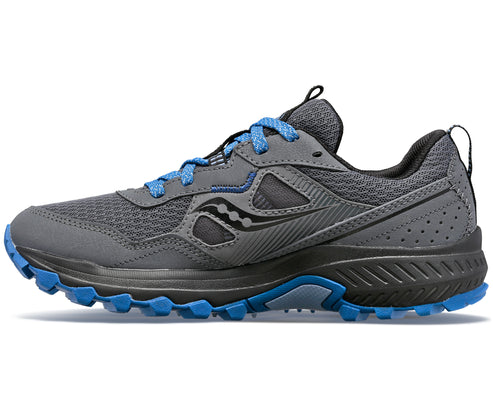Gray trail running shoe with blue laces and lugged outsole, showing side profile.