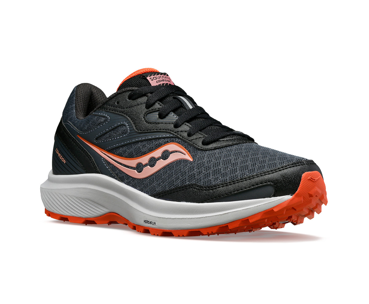 Athletic shoe, dark gray mesh upper with orange accent, white midsole, orange lugged outsole.