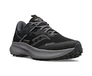Black and grey running shoe with lug sole and Gore-Tex marking.