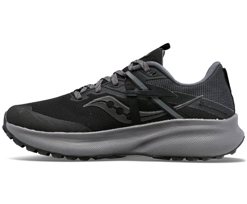 A black and gray running shoe with a thick gray sole, a black mesh upper, and black Saucony logo on the side.