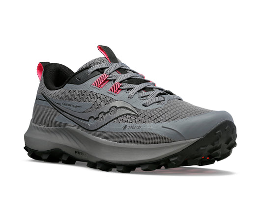 Gray trail running shoe with a black sole and pink accents.