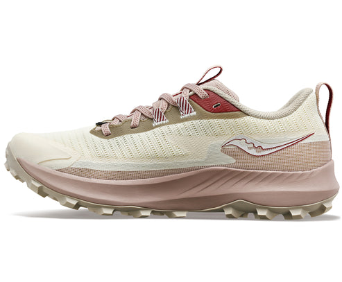 A light pink and beige trail running shoe with a prominent logo.