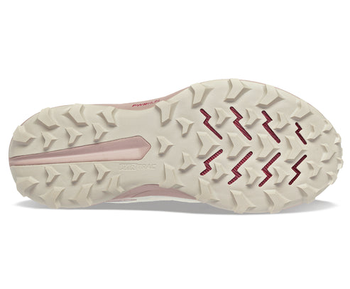 Sole of a shoe with beige treads and a hint of maroon.