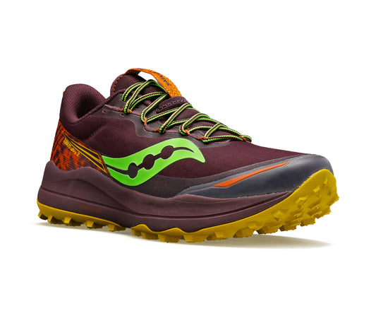 Trail running shoe: Maroon with green logo, black toe, orange heel and yellow sole.
