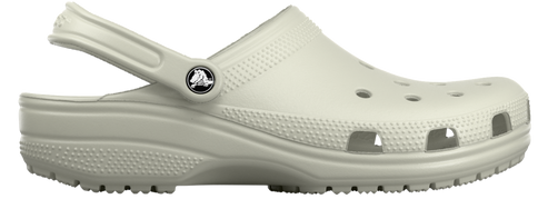 Side view of a light beige clog with a pivoting heel strap and ventilation holes.