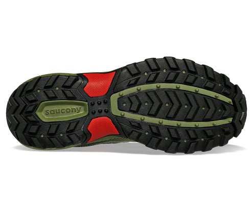 Underside of a shoe with black rubbery treads and green accents.