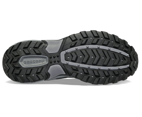 Shoe sole with deep lugs and the word "saucony".