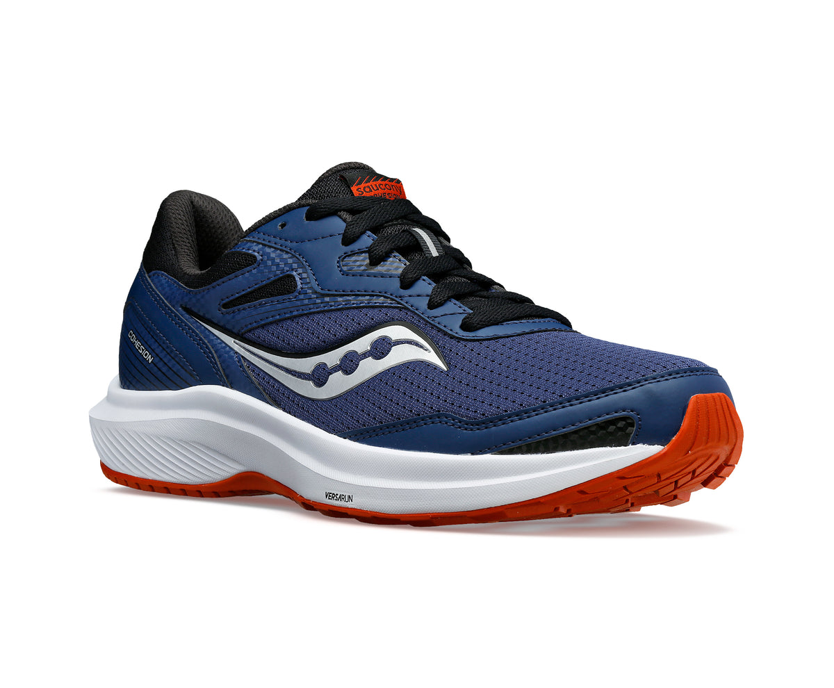A navy and orange running shoe with black laces and a white sole.