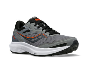 A gray and black athletic shoe with orange accents, black laces, and a thick white sole.