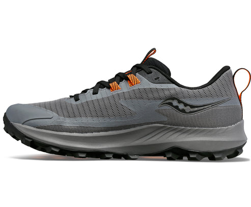 Side view of a gray running shoe with black laces and an orange accent.